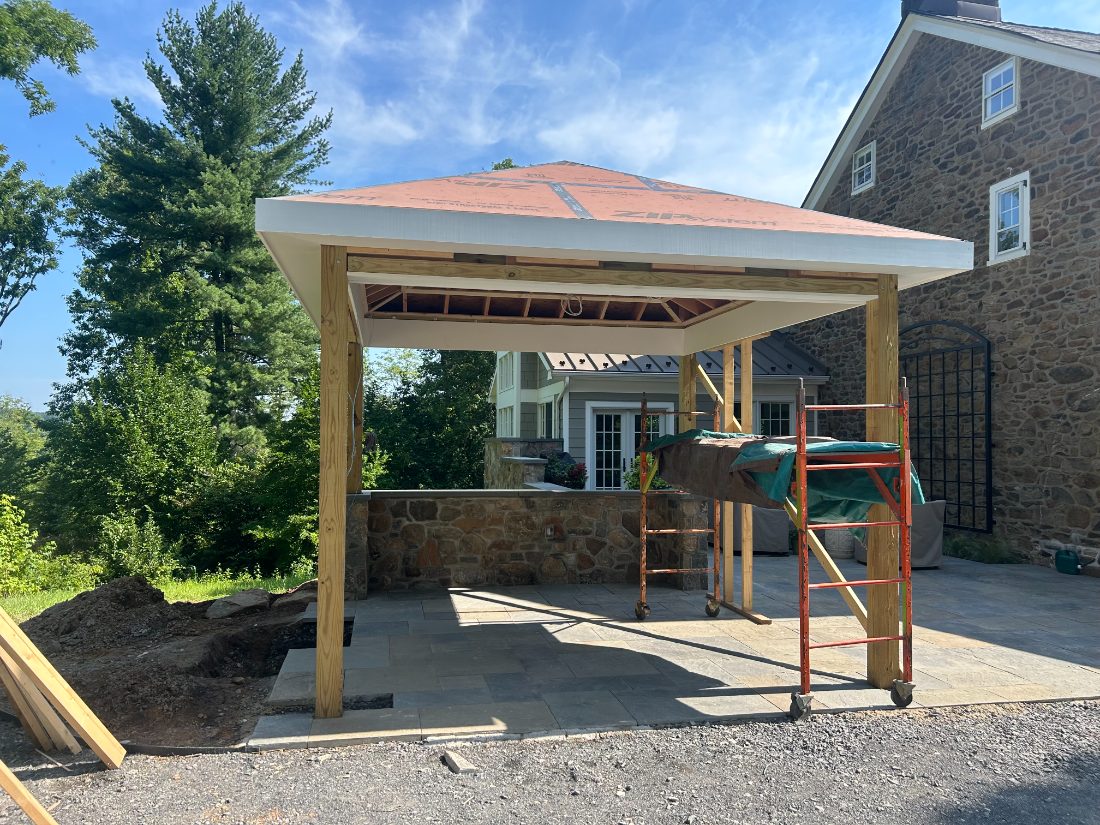 Outdoor pavilion and stone bar under construction
