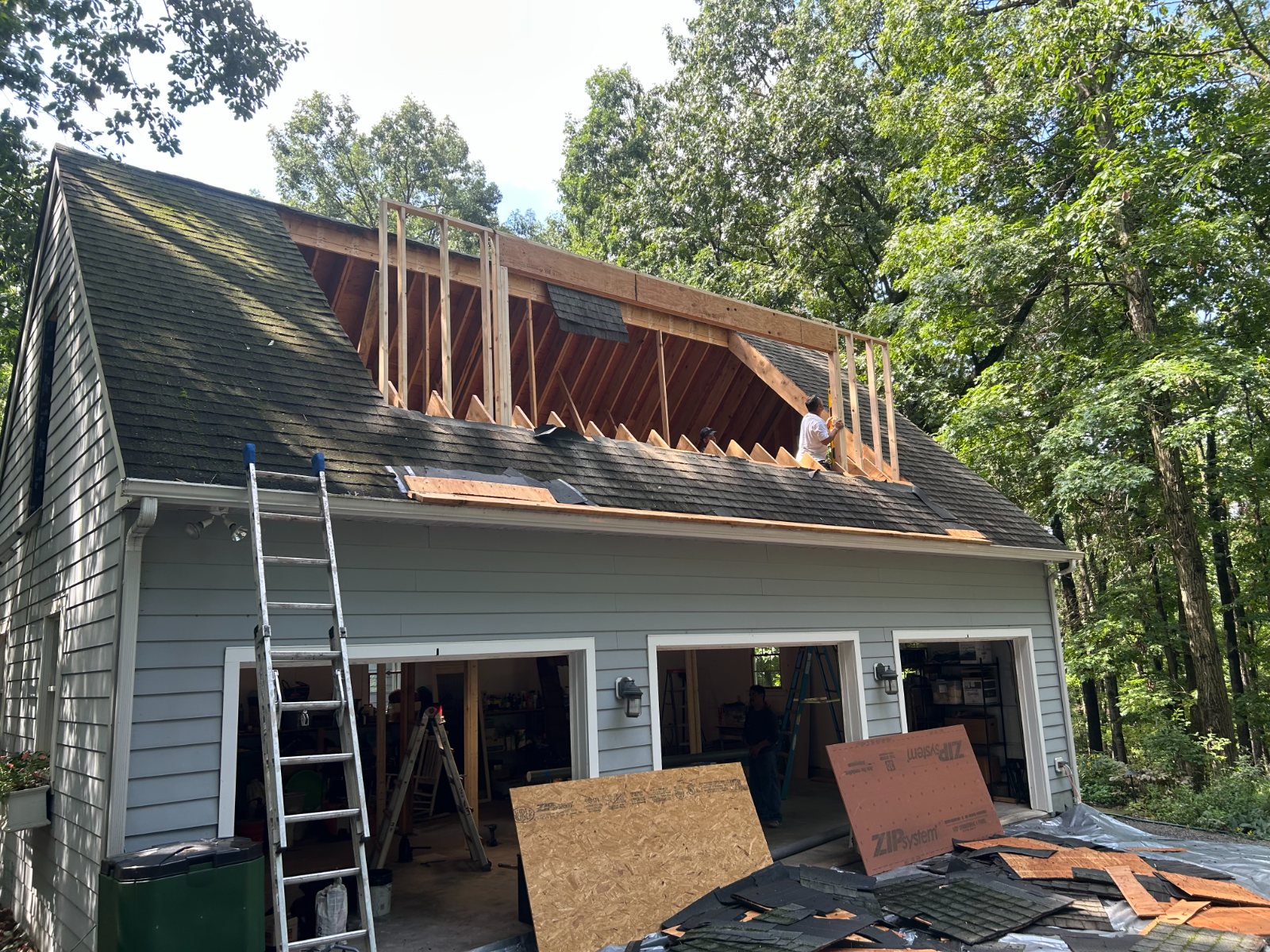 Garage roof opened up with new dormer framing going in