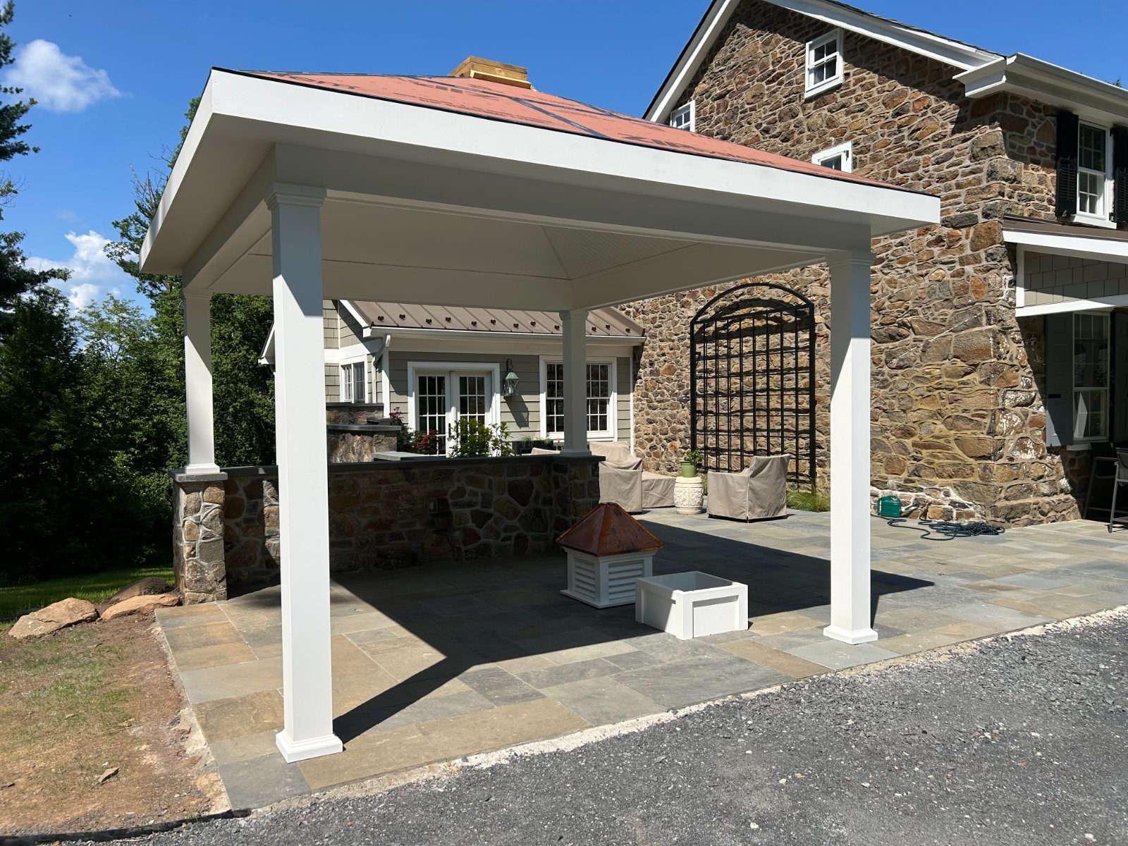 Pavilion wrapped and papered, copper cupola staged on the patio